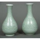 A pair of Chinese celadon ground vases Each with a lappet decorated flared neck above the main