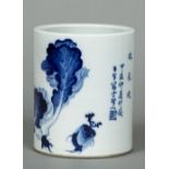 A Chinese porcelain blue and white brush pot Decorated with foliage and with further calligraphic