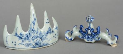 A Chinese blue and white porcelain brush rest Decorated with floral sprays; together with another.