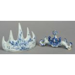 A Chinese blue and white porcelain brush rest Decorated with floral sprays; together with another.