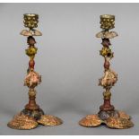 A pair of cold painted bronze candlesticks Each formed as various sea shells. Each 23.5 cm high.