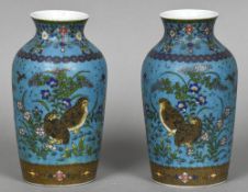 A pair of 19th century Japanese cloisonne on porcelain vases Each decorated with floral sprays,