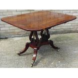 A 19th century mahogany tilt top breakfast table The crossbanded rounded rectangular top above twin