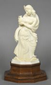 A late 19th/early 20th century Indian carved ivory figure Worked as a scantily clad female,