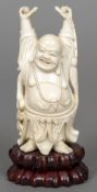 A late 19th/early 20th century Chinese carved ivory model of Buddha Modelled standing holding a