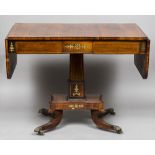 A Regency brass inlaid rosewood sofa table The boxwood line inlaid twin flap rounded rectangular