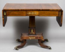 A Regency brass inlaid rosewood sofa table The boxwood line inlaid twin flap rounded rectangular