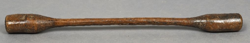 A 19th century treen grain pestle/pounder Of typical double ended form. 102 cm long.