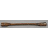 A 19th century treen grain pestle/pounder Of typical double ended form. 102 cm long.