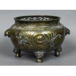 A Chinese bronze censor The flared pierced top rim above twin beast mask handles,