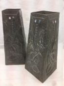 A pair of Arts & Crafts gem stone set pewter clad vases Each of spreading square section and