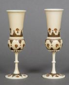 A pair of late 19th/early 20th century Eastern ivory stem vases Each of turned form with dot and