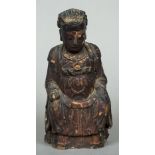 An antique Chinese painted wooden temple figure Modelled seated in flowing robes with iron red and