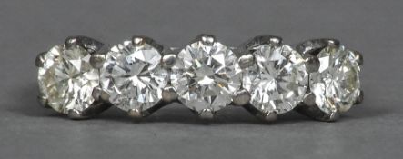 An 18 ct white gold five stone diamond ring Each claw set stone spreading to just under 0.5 carat.