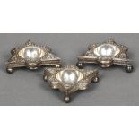 Three Hanau silver renaissance style table salts Each of lobed triangular form with embossed