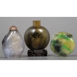 A Chinese agate snuff bottle Of typical rounded form,