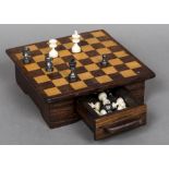 An ivory and stained ivory Staunton pattern chess set, circa 1900 One side natural in colour,