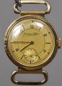 A 14 ct gold cased lady's wristwatch The tri-coloured gold dial with Arabic numerals, baton markers,