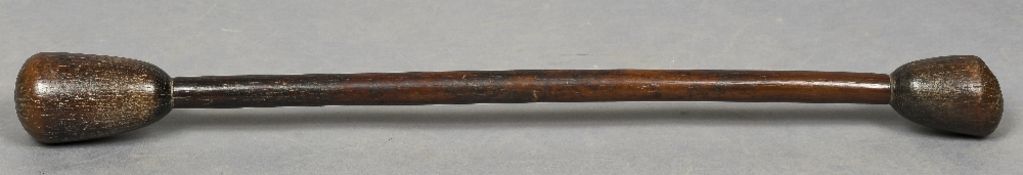 A large 19th century treen grain pestle/pounder Of typical large double ended form. 106 cm long.