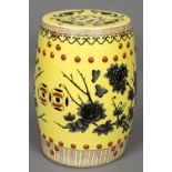 A Chinese porcelain garden seat Of typical pierced barrel form, decorated with flowers,