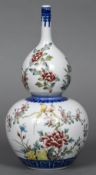 A Chinese porcelain vase Of double gourd form, decorated with birds amongst foliage,