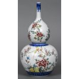 A Chinese porcelain vase Of double gourd form, decorated with birds amongst foliage,