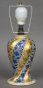 An Indian Kashmiri papier mache lamp base Spiral moulded and decorated with blue and gilt strapwork,