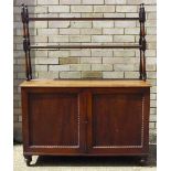 A 19th century mahogany bookcase The two upper tiers supported on turned uprights above the