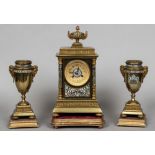 A 19th century French gilt metal and champleve enamelled triple clock garniture The 10 cm dial with
