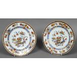 A pair of 18th century Chinese porcelain plates Each decorated with floral sprays,