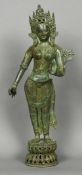 A large Indian patinated bronze model of a female deity Modelled standing, wearing a headdress.