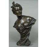 An Art Nouveau patinated bronze bust Formed as a young woman, a ribbon in her hair,