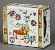 A late 19th century Chinese famille rose flower brick Of typical pierced rectangular section form,