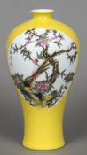 A Chinese Republic period porcelain vase Of slender baluster form, decorated with bird vignettes,