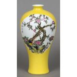 A Chinese Republic period porcelain vase Of slender baluster form, decorated with bird vignettes,