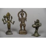 Three Indian bronze figures Each of varying form. The largest 15.5 cm high.