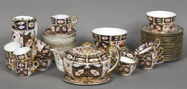 A good quantity of Royal Crown Derby tea wares, pattern 2451 Comprising: teapot, cover and stand,