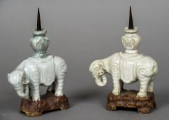 Two small Chinese pottery pricket sticks Each formed as an elephant mounted with a vase. Each 19.