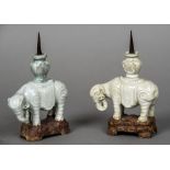 Two small Chinese pottery pricket sticks Each formed as an elephant mounted with a vase. Each 19.