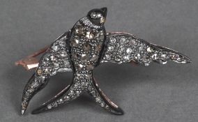 An unmarked gold and 925 silver rose diamond brooch Formed as a swallow. 4.5 cm wide.