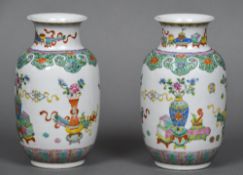 A pair of late 19th/early 20th century brightly painted Chinese porcelain vases Decorated with