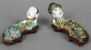 A pair of Chinese porcelain figural water droppers Each formed as a recumbent figure, one male,