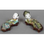 A pair of Chinese porcelain figural water droppers Each formed as a recumbent figure, one male,