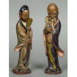 A pair of Chinese terracotta figures Modelled as a sage and his female companion,