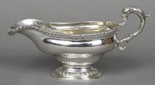 An 18th century Scottish silver pedestal sauce boat, possibly hallmarked for Edinburgh 1758,