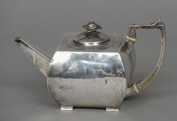 A George III silver teapot, hallmarked London 1802, maker's mark of IR Of squat square form,