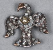 An unmarked and gold bird form brooch,