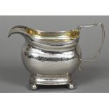 A George III silver cream jug, hallmarked London 1809,