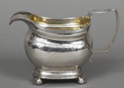 A George III silver cream jug, hallmarked London 1809,