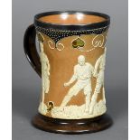 A Doulton Lambeth stoneware tankard Of waisted cylindrical form,